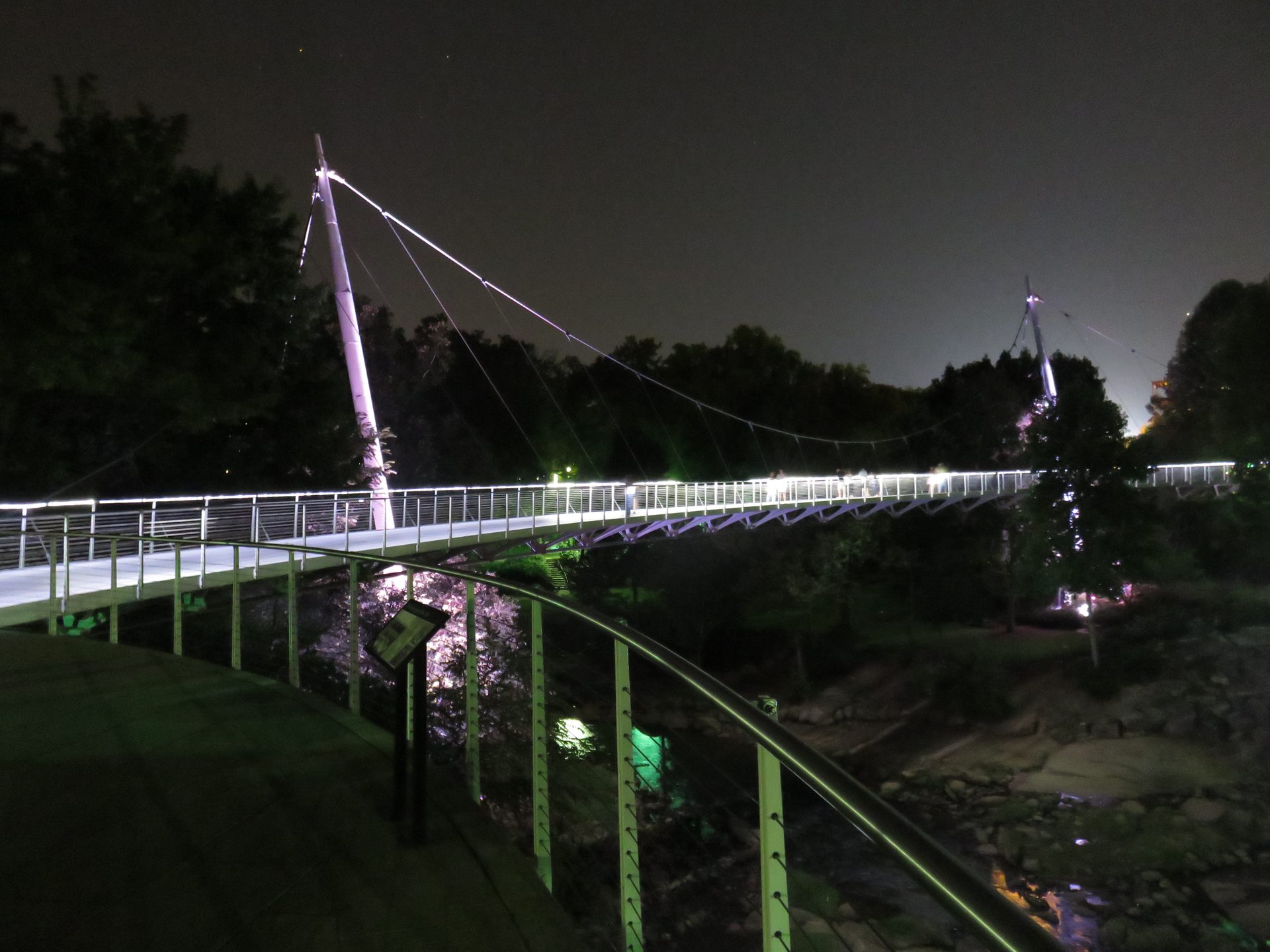 Liberty Bridge at night above the Reedy River, Falls Park, downtown Greenville